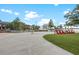 Modern community space featuring well-maintained landscaping, chairs, and a sidewalk at 12510 Ghiberti Cir # 102, Venice, FL 34293