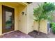 Close-up of the entryway featuring a decorative door and garden at 12510 Ghiberti Cir # 102, Venice, FL 34293