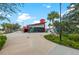 Modern building exterior with a unique design, expansive windows, and landscaped surroundings, adding to its appeal at 12510 Ghiberti Cir # 102, Venice, FL 34293