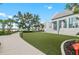 Well-maintained exterior with sidewalk, lawn and landscaping at 12510 Ghiberti Cir # 102, Venice, FL 34293