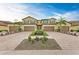 Symmetrical front view of a villa with a well-manicured garden at 12510 Ghiberti Cir # 102, Venice, FL 34293