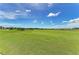 Expansive view of a well-maintained golf course with lush green fairways and blue skies, perfect for a day on the links at 12510 Ghiberti Cir # 102, Venice, FL 34293