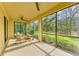 A screened porch with furniture and nature views at 12510 Ghiberti Cir # 102, Venice, FL 34293