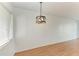 Inviting dining area boasting hardwood floors and an elegant pendant light fixture at 1517 Pleasant Rd # A22, Bradenton, FL 34207