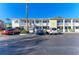 Exterior view showcasing the building's facade with ample parking available for residents at 1517 Pleasant Rd # A22, Bradenton, FL 34207