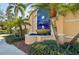 Attractive community water feature with vibrant blue tile and manicured landscaping at 1555 Napoli W Dr, Sarasota, FL 34232