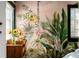 Tropical-themed room with colorful wallpaper, sunflowers, and natural light at 1609 1St W Ave, Bradenton, FL 34205