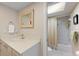 Bathroom with a shower and bathtub combo, a modern sink, and natural light at 1612 Pine Harrier Cir, Sarasota, FL 34231