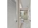 Hallway view of the bathroom featuring a tiled shower with glass doors at 1612 Pine Harrier Cir, Sarasota, FL 34231