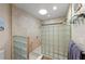 Bathroom features glass block shower, neutral tile, and dual shower heads at 1612 Pine Harrier Cir, Sarasota, FL 34231