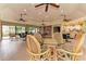 Bright community room featuring ceiling fans, bookshelves, and a kitchenette for residents' use at 1612 Pine Harrier Cir, Sarasota, FL 34231