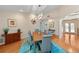 Dining room featuring natural light, seating for six, and wood floors at 1612 Pine Harrier Cir, Sarasota, FL 34231