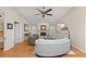 Cozy living room featuring a fireplace, comfortable seating, and ample natural light from the windows at 1612 Pine Harrier Cir, Sarasota, FL 34231