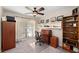 Bright office space with custom shelving, lots of natural light, and a classic writing desk at 1612 Pine Harrier Cir, Sarasota, FL 34231