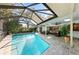 Enjoy the screened-in pool and patio area, ideal for outdoor entertaining at 1612 Pine Harrier Cir, Sarasota, FL 34231