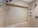 Oversized shower features neutral tile, built-in bench, and dual shower heads at 1612 Pine Harrier Cir, Sarasota, FL 34231