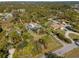 Overhead view of property with mature tree coverage, lovely pool, and ample parking at 1627 Bayshore Dr, Englewood, FL 34223