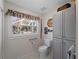 Bright bathroom featuring a window view and ample storage at 1627 Bayshore Dr, Englewood, FL 34223