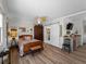 Bedroom featuring wood look floors and an ensuite bath at 1627 Bayshore Dr, Englewood, FL 34223