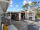 View of an organized shed with workbench, shelving, storage and covered area, ideal for projects and storage needs at 1627 Bayshore Dr, Englewood, FL 34223