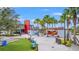 Exterior view of an outdoor community amenity space, with dining and seating at 19715 Tortuga Cay Dr, Venice, FL 34293