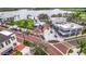 Aerial view of mixed-use community featuring shopping, recreation, and dining by a lake at 19715 Tortuga Cay Dr, Venice, FL 34293