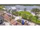 Aerial view of mixed-use community with lake, retail shopping, and green spaces at 19715 Tortuga Cay Dr, Venice, FL 34293