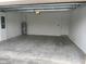 Spacious garage with ample room for parking and storage at 19715 Tortuga Cay Dr, Venice, FL 34293