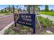 Downtown Wellen Park sign surrounded by lush landscaping at the entrance at 19715 Tortuga Cay Dr, Venice, FL 34293