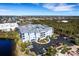 Aerial view of the condo complex showcasing the surrounding lush greenery and well-maintained parking area at 2001 Bal Harbor Blvd # 2301, Punta Gorda, FL 33950