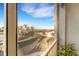 Bright balcony view overlooking a waterway with lush palm trees and clear skies at 2001 Bal Harbor Blvd # 2301, Punta Gorda, FL 33950