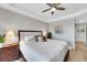 Comfortable bedroom featuring a ceiling fan, a nightstand with a lamp, and a stylish art piece at 2001 Bal Harbor Blvd # 2301, Punta Gorda, FL 33950