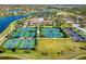 Aerial view of community sports courts and clubhouse at 20078 Elegante Ct, Venice, FL 34293