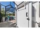 Outdoor shower gate providing privacy next to the pool area at 20078 Elegante Ct, Venice, FL 34293