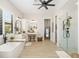 Spacious main bathroom featuring a soaking tub, dual vanities, modern fixtures, and a glass-enclosed shower at 20078 Elegante Ct, Venice, FL 34293