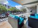 Comfortable balcony area with blue cushioned seating, perfect for outdoor relaxation and socializing at 201 W Laurel St # 209, Tampa, FL 33602