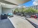 Relaxing outdoor balcony furnished with a blue cushioned couch, chairs, and a small table at 201 W Laurel St # 209, Tampa, FL 33602