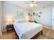 Bright bedroom features stylish decor, a ceiling fan, and a comfortable queen-sized bed at 201 W Laurel St # 209, Tampa, FL 33602