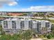 Multi-story condo building with multiple balconies and mature trees offering shade at 201 W Laurel St # 209, Tampa, FL 33602