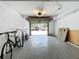 Spacious garage with white walls, epoxy flooring, and an open door to the outside at 201 W Laurel St # 209, Tampa, FL 33602