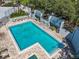 Aerial view of a refreshing community pool featuring lounge chairs and lush landscaping at 201 W Laurel St # 209, Tampa, FL 33602