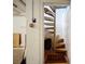 Spiral staircase leading from the basement with accent lighting and modern design at 201 W Laurel St # 209, Tampa, FL 33602