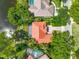 Aerial view of a home with a screened-in lanai and tropical landscaping at 2081 Timucua Trl, Nokomis, FL 34275