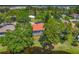 Aerial view of home and lush landscaping backing up to a serene pond at 2081 Timucua Trl, Nokomis, FL 34275