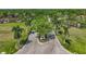 Stunning entrance with mature palms and manicured landscaping leading to a serene community at 2081 Timucua Trl, Nokomis, FL 34275