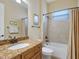 Well-maintained bathroom with granite countertop vanity and shower-tub combination at 20909 Loggia Ct, Venice, FL 34293