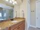 Spacious bathroom with granite vanity, wood cabinets, and walk in shower at 20909 Loggia Ct, Venice, FL 34293