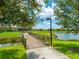 A charming wooden bridge over a pond in a residential community at 20909 Loggia Ct, Venice, FL 34293