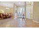 Inviting foyer featuring tile flooring, chandelier, and an open view of the dining area, offering a spacious and elegant entrance at 20909 Loggia Ct, Venice, FL 34293