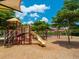 A colorful playground with slides, swings, and climbing structures at 20909 Loggia Ct, Venice, FL 34293